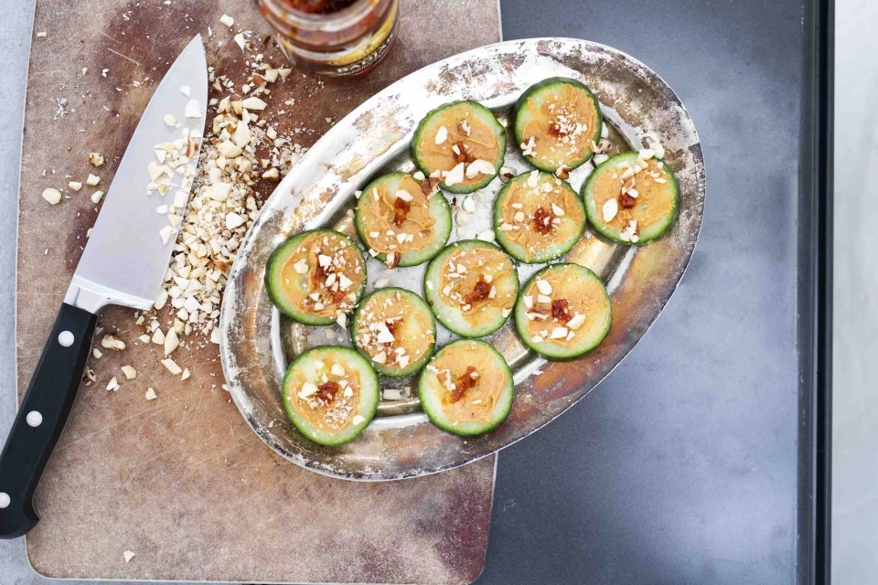 Cucumber slices with peanut butter & Sriracha 