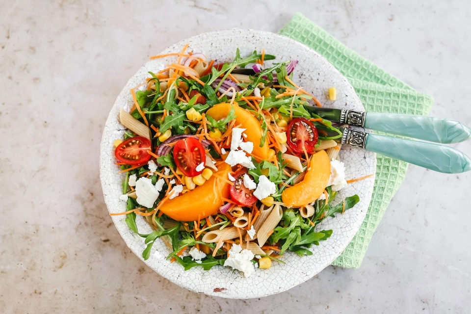 Pasta salad with peach, corn & feta