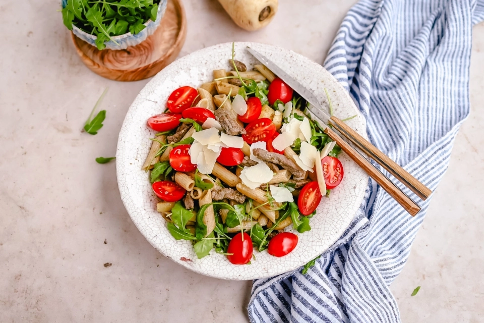 Penne with beef strips, parsnip & pesto