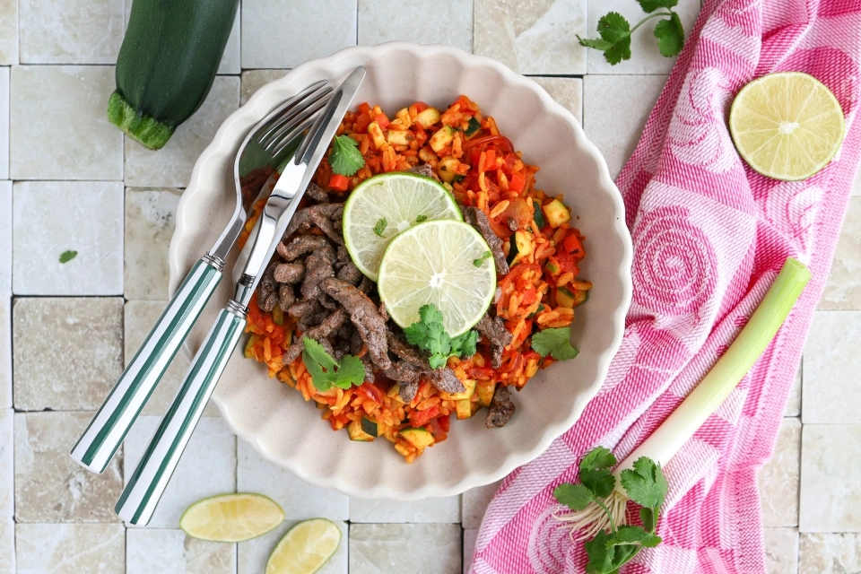 Spanish rice with beef strips, bell pepper & zucchini